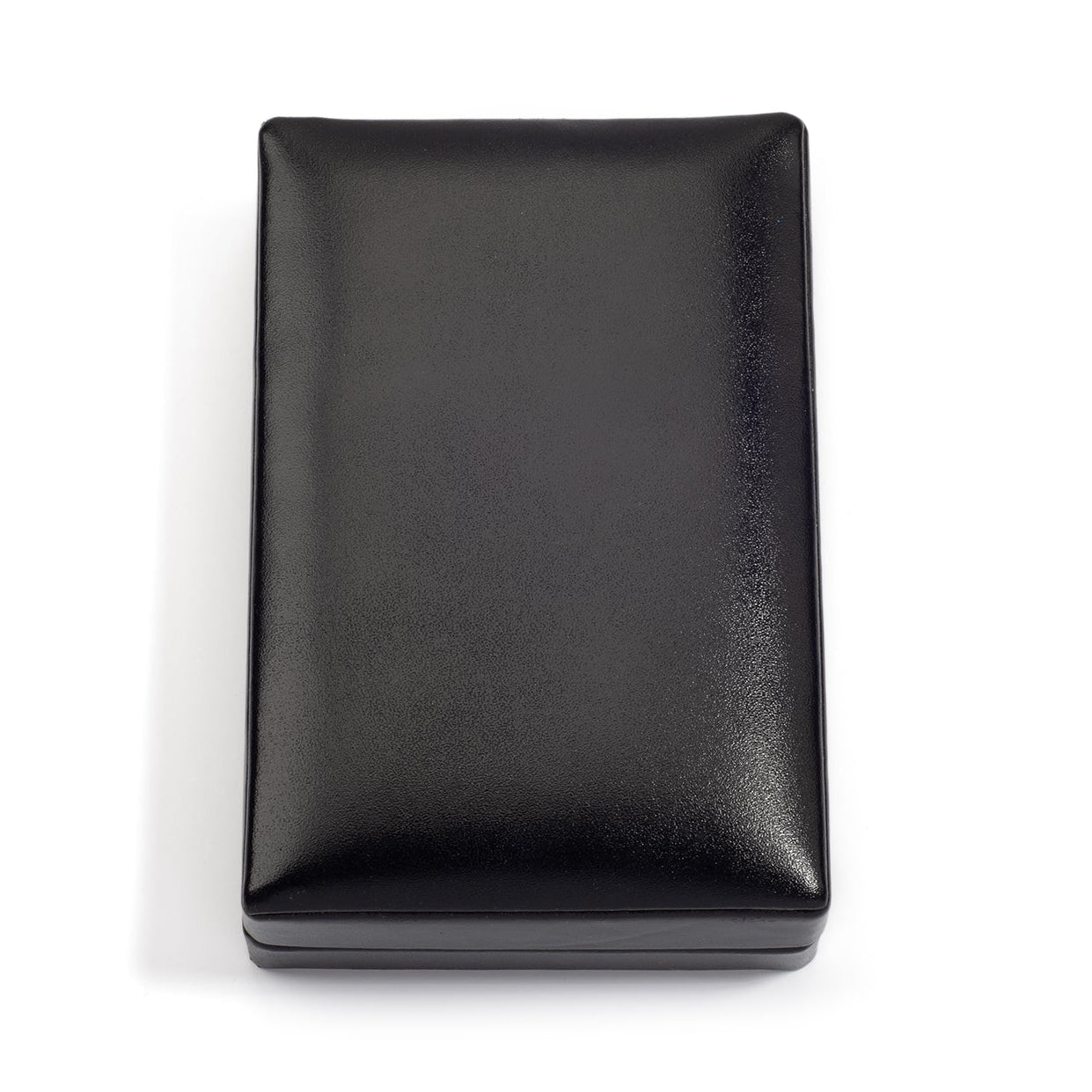 A closed, rectangular black jewelry box with a smooth, shiny surface, placed on a white background.