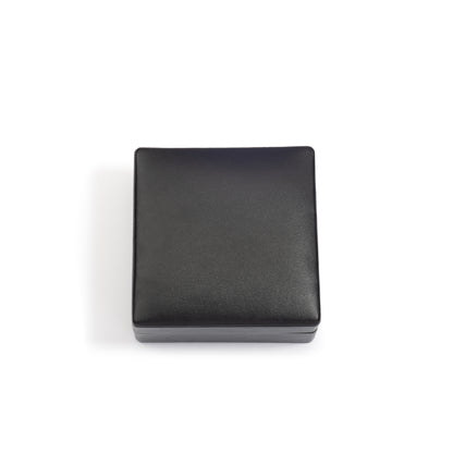 A closed, square-shaped black jewellery box with a smooth finish, positioned against a white background.